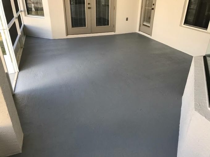 Smooth gray floor coating on a screened Florida patio