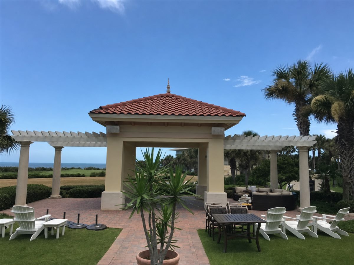 Painted resort courtyard, pergola and pavilion near the Atlantic coast