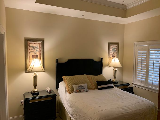 Neutral painted bedroom with crisp white crown molding