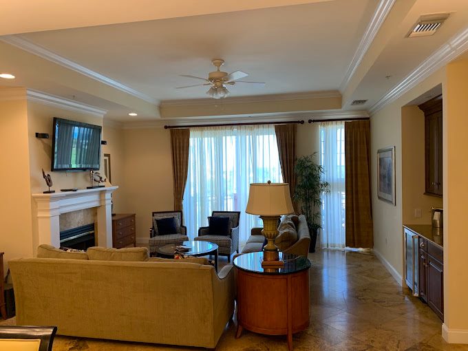 Professionally painted living room with white ceiling trim